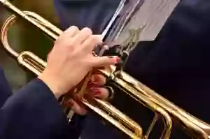 Women Holding a Trumpet