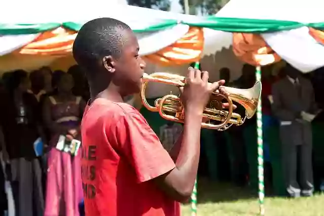 Young man playing a cornet