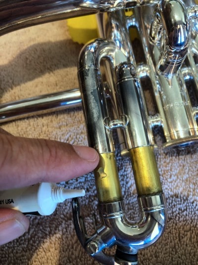 I'm applying slide grease to my personal Yamaha 631GS Flugelhorn 1st slide with my left index finger.