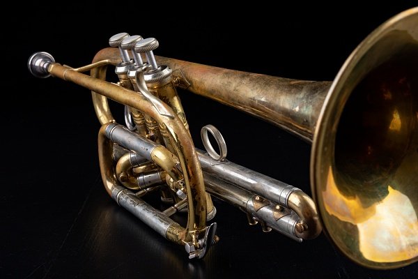 A vintage cornet with a lacquer finish and nickel plating on some tubes
